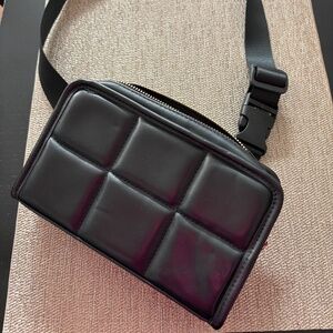 Amanda Uprichard black belt bag. Can be worn across the body or on waist.